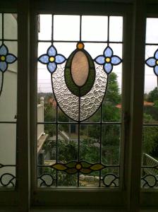 Stained glass window with blue flowers