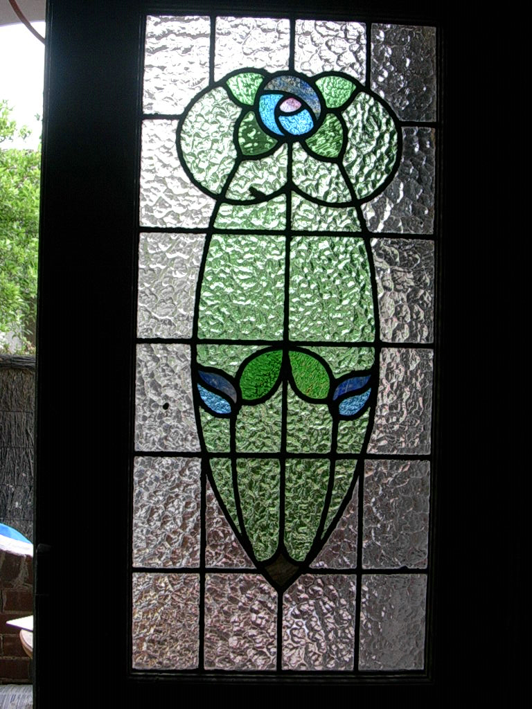 Stylised rose in blue and green glass